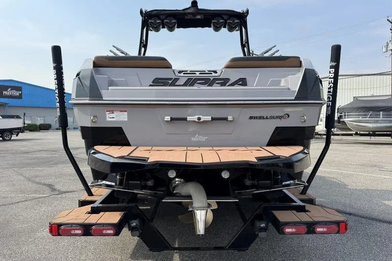 Slide: The Image of 2023 Supra SL boat rear view with swim platform and propeller. - 7