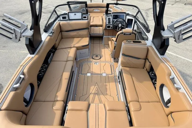 Slide: The Image of 2023 Supra SL boat interior with tan leather seating and modern dashboard. - 9