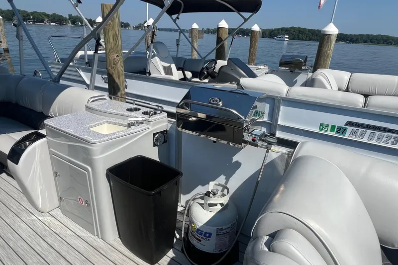 Slide: The Image of 2022 SunCatcher Elite 326C pontoon boat with grill and sink on deck. - 20