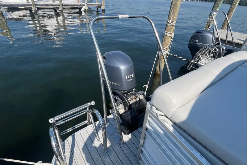 Slide: The Image of 2022 SunCatcher Elite 326C pontoon boat with Yamaha 115 outboard motor at dock. - 22
