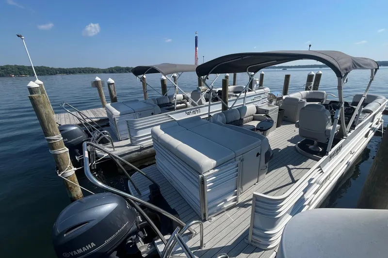 Slide: The Image of 2022 SunCatcher Elite 326C pontoon boat docked on a sunny day, featuring Yamaha outboard motor. - 3