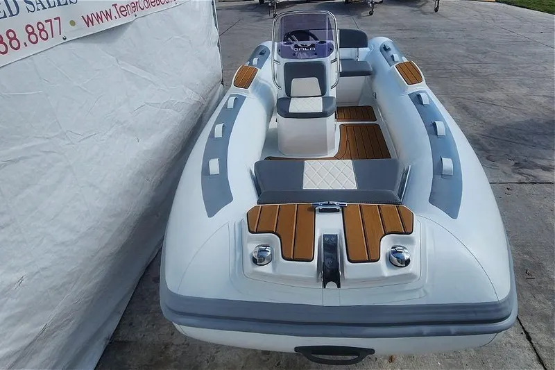 Slide: The Image of 2025 Gala A400L inflatable boat with sleek design and wood accents. - 5