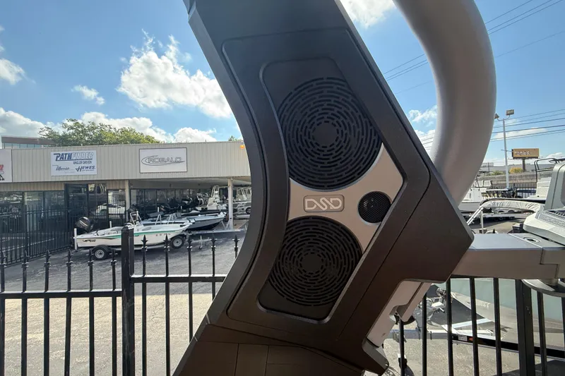 Slide: The Image of Outdoor view of 2026 Supra SA 450 boat speakers with dealership in background. - 13