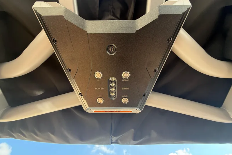 Slide: The Image of Control panel of 2026 Supra SA 450 boat, featuring tower and bimini functions. - 14