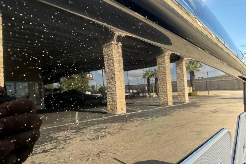 Slide: The Image of Reflection on 2026 Supra SA 450 boat, showcasing sleek design and outdoor setting. - 3