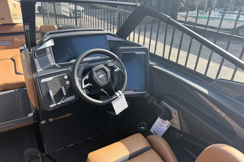 Slide: The Image of 2026 Supra SA 450 boat dashboard with steering wheel and digital display. - 7