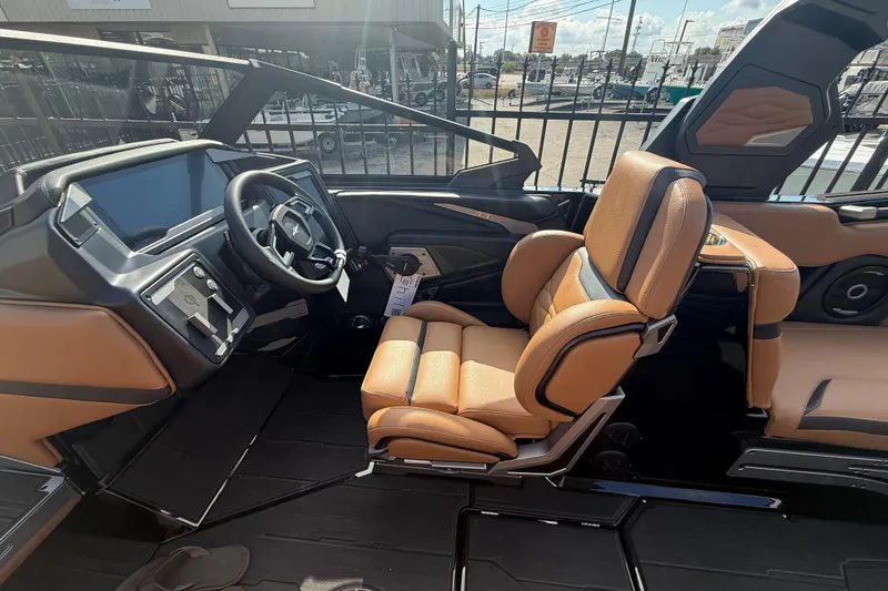 Slide: The Image of Interior of 2026 Supra SA 450 boat with tan leather seats and modern dashboard. - 8