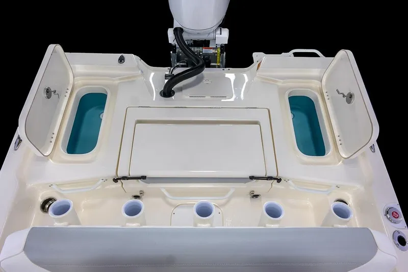 Slide: The Image of Manufacturer Provided Image: 2026 Skeeter SX221 boat deck with storage compartments and cup holders. - 18