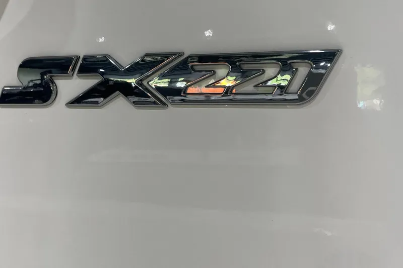 Slide: The Image of 2026 Skeeter SX221 logo on a sleek white surface. - 2