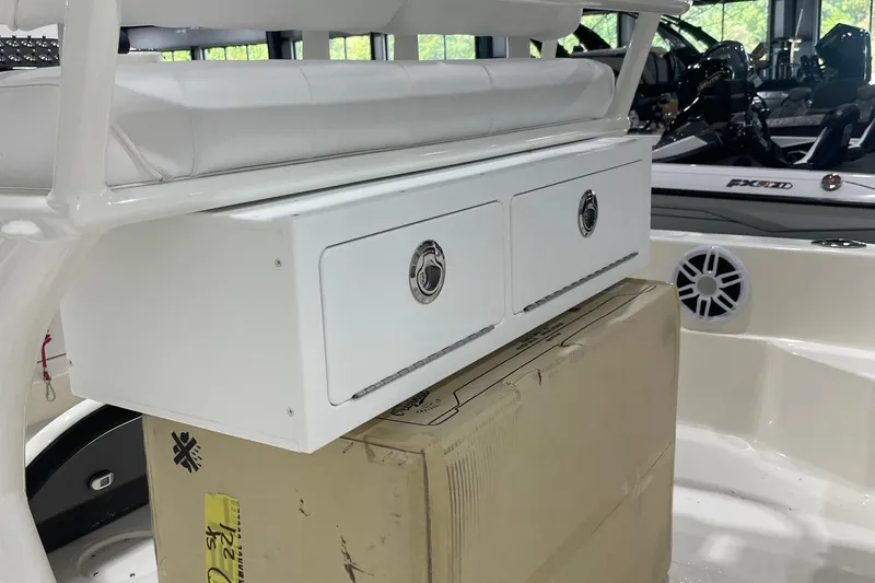 Slide: The Image of 2026 Skeeter SX221 boat interior with storage drawers and seating. - 8