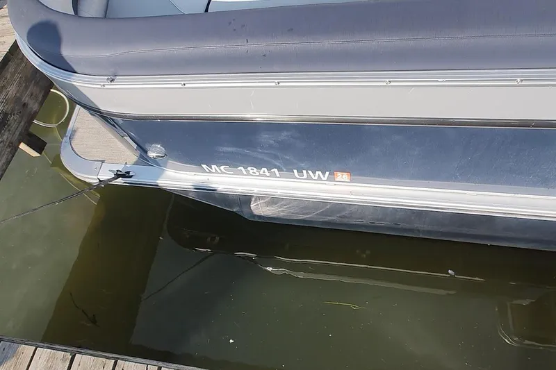 Slide: The Image of 2023 Tahoe Pontoon Cascade Funship docked, showing registration number MC 1841 UW. - 14