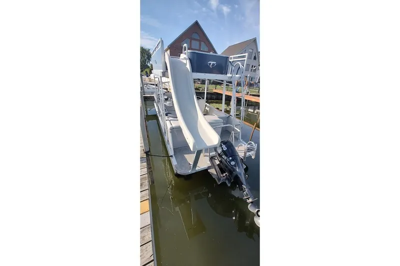 Slide: The Image of 2023 Tahoe Pontoon Cascade Funship with slide, docked on a sunny day. - 16