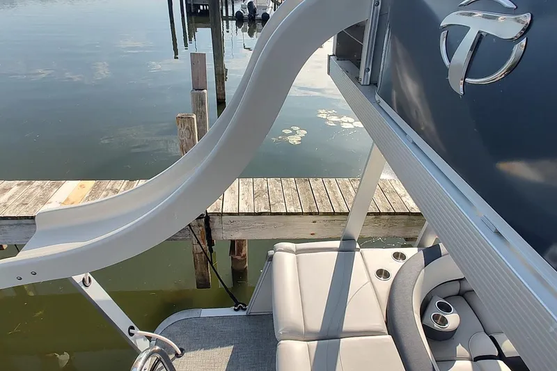 Slide: The Image of 2023 Tahoe Pontoon Cascade Funship with slide, docked by calm water. - 3