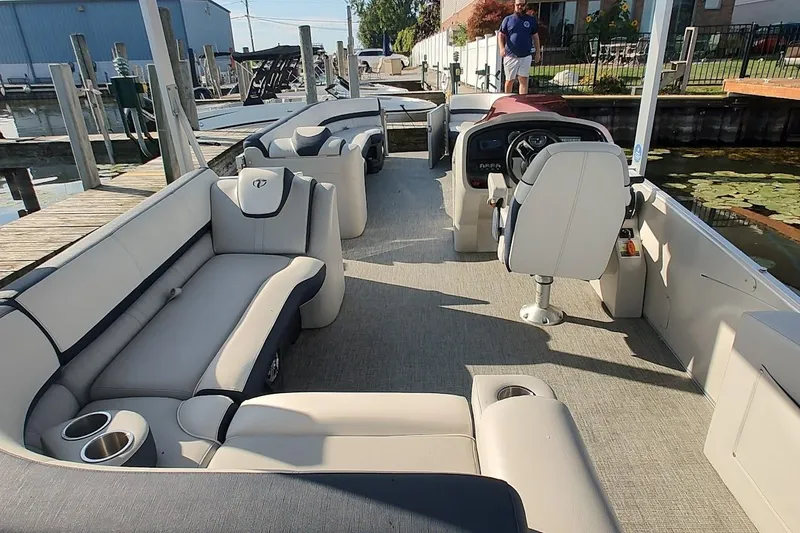 Slide: The Image of 2023 Tahoe Pontoon Cascade Funship interior with plush seating and modern helm. - 5