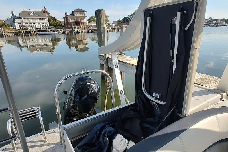 Slide: The Image of 2023 Tahoe Pontoon Cascade Funship docked by serene waterfront homes. - 6