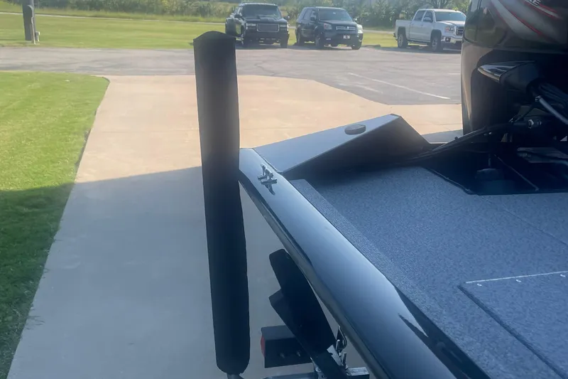 Slide: The Image of 2017 Tracker Pro Team 175 TXW boat on driveway, with vehicles in background. - 10