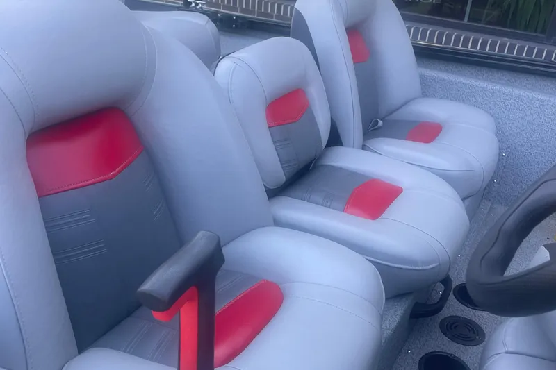 Slide: The Image of 2017 Tracker Pro Team 175 TXW boat seats with gray and red upholstery. - 5