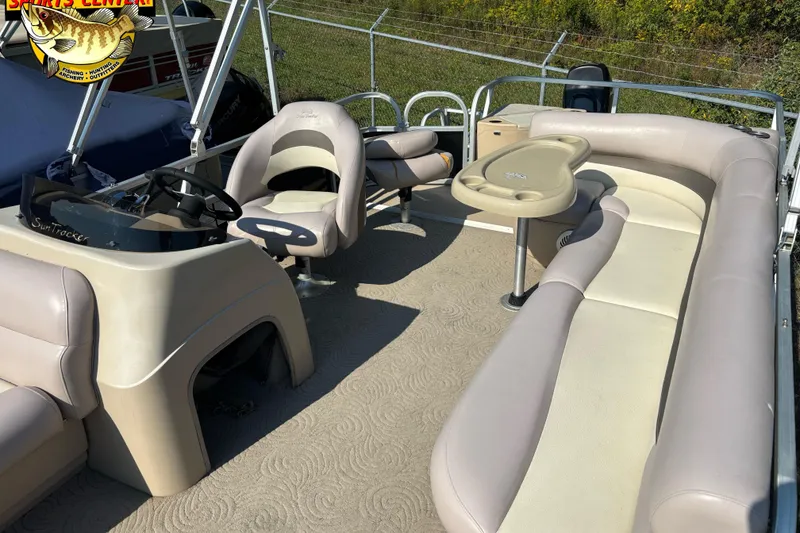 Slide: The Image of 2014 Sun Tracker Fishin' Barge 20 DLX interior with seating and steering console. - 10
