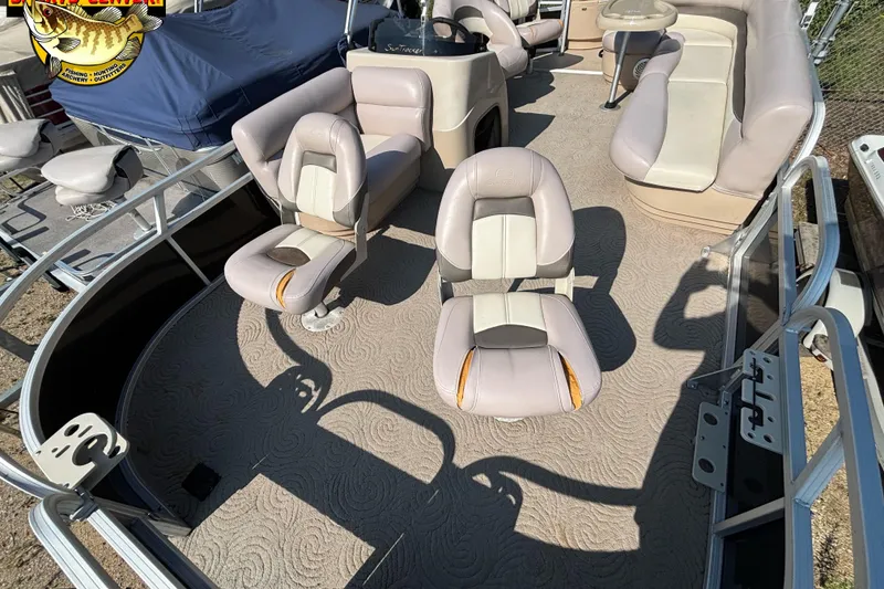 Slide: The Image of 2014 Sun Tracker Fishin' Barge 20 DLX interior with seating and steering console. - 7