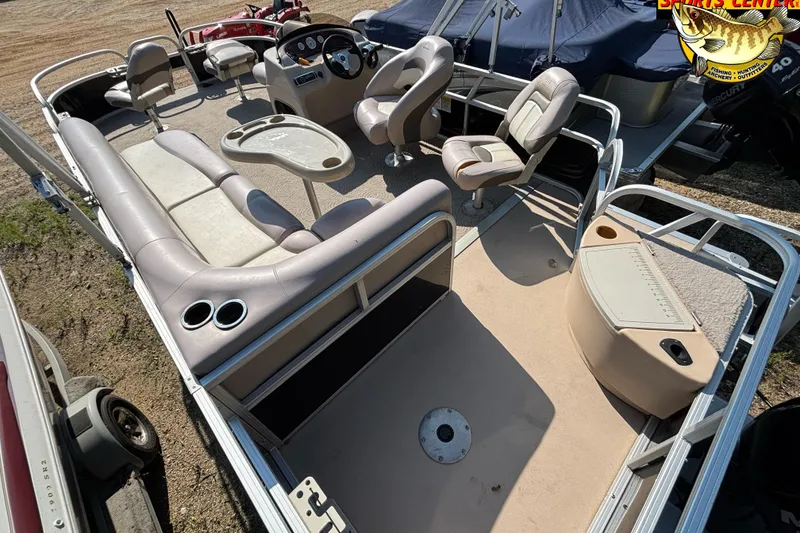 Slide: The Image of 2014 Sun Tracker Fishin' Barge 20 DLX interior with seating and steering console. - 8