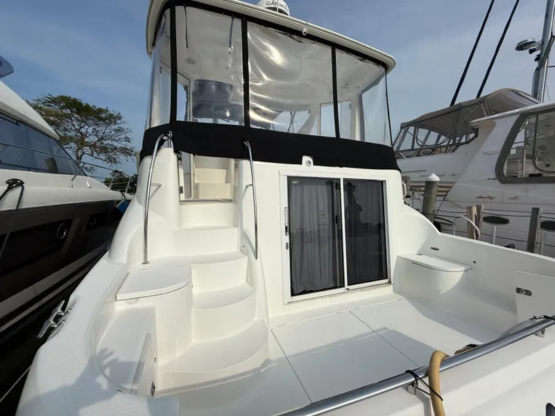 Slide: The Image of 2005 Meridian 459 Motoryacht with spacious deck and enclosed upper helm area. - 11