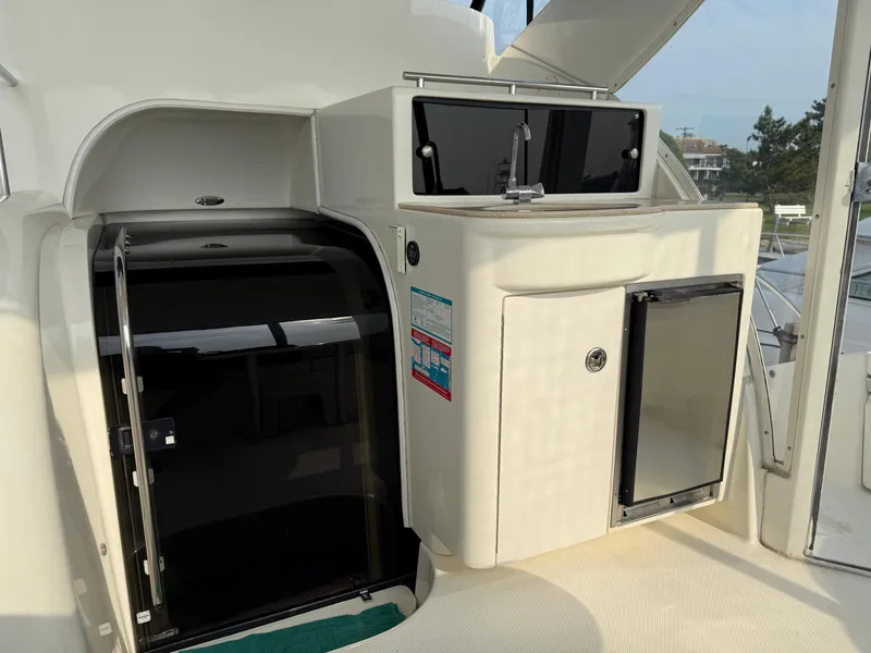 Slide: The Image of 2005 Meridian 459 Motoryacht interior with kitchenette and storage area. - 15