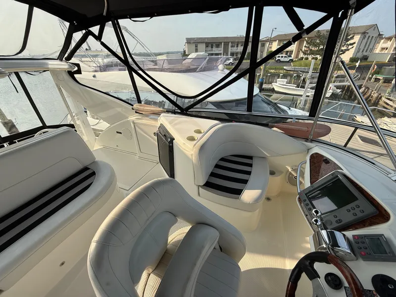 Slide: The Image of Luxurious 2005 Meridian 459 Motoryacht cockpit with plush seating and modern controls. - 19