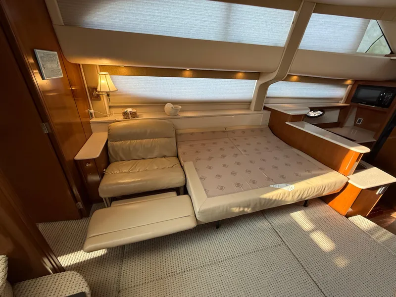 Slide: The Image of Interior of 2005 Meridian 459 Motoryacht with cozy seating and elegant lighting. - 32