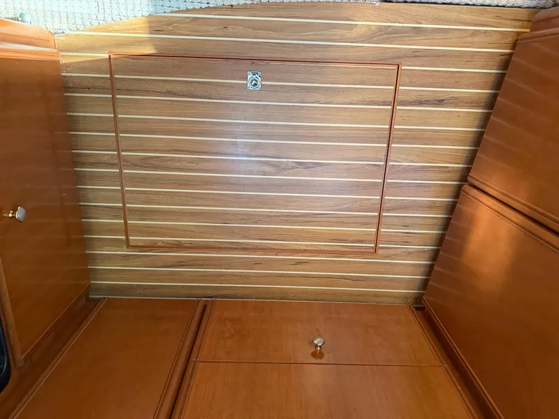 Slide: The Image of Wooden interior of 2005 Meridian 459 Motoryacht, featuring sleek cabinetry and paneling. - 35