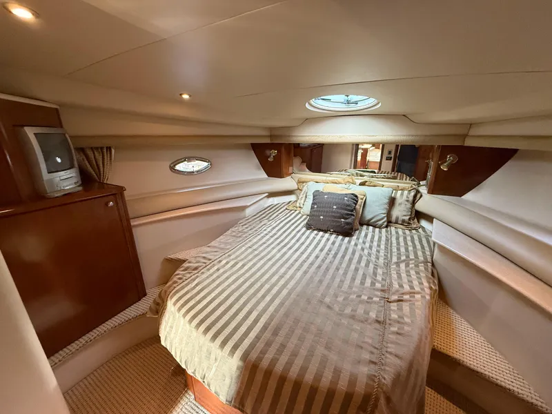 Slide: The Image of Luxurious cabin interior of 2005 Meridian 459 Motoryacht with cozy bed and elegant decor. - 38