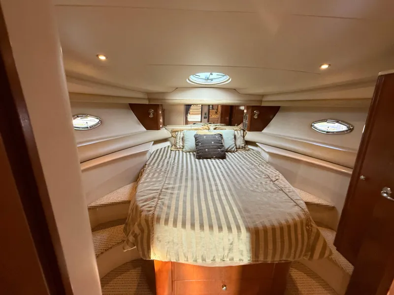 Slide: The Image of Luxurious bedroom in 2005 Meridian 459 Motoryacht with elegant bedding and ambient lighting. - 39