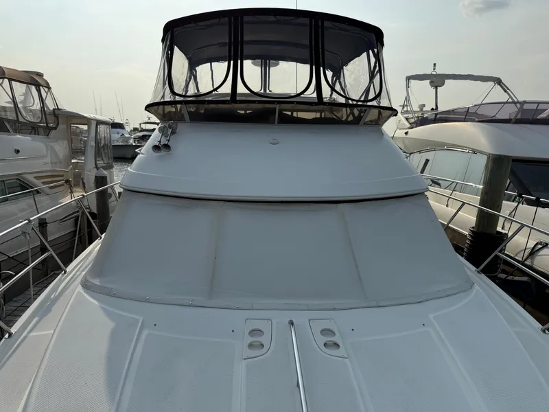 Slide: The Image of 2005 Meridian 459 Motoryacht docked at marina, front view. - 4