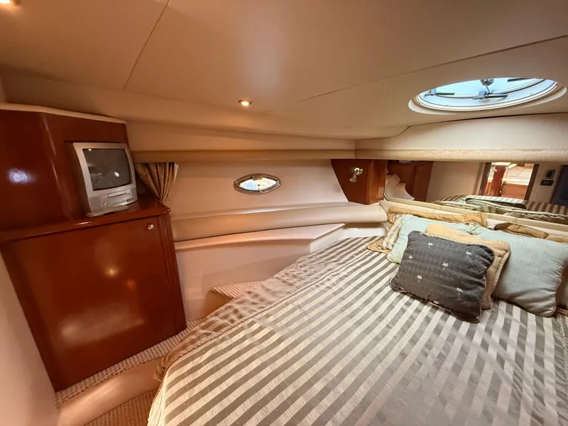 Slide: The Image of Luxurious cabin interior of 2005 Meridian 459 Motoryacht with cozy bedding and TV. - 41
