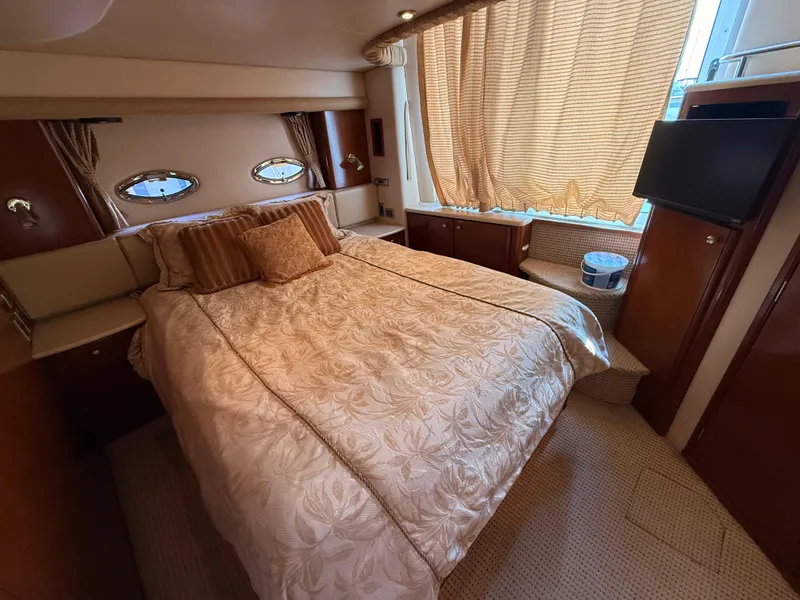 Slide: The Image of Luxurious bedroom in 2005 Meridian 459 Motoryacht with elegant bedding and natural light. - 47