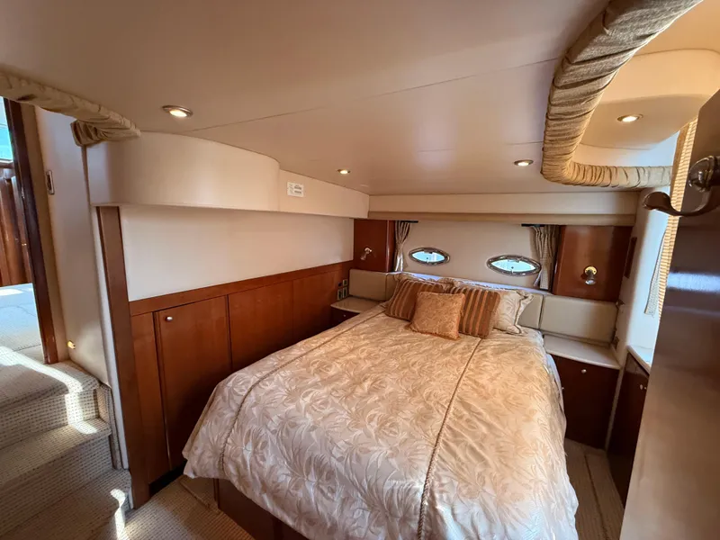 Slide: The Image of Luxurious bedroom interior of 2005 Meridian 459 Motoryacht with elegant bedding and wood accents. - 49
