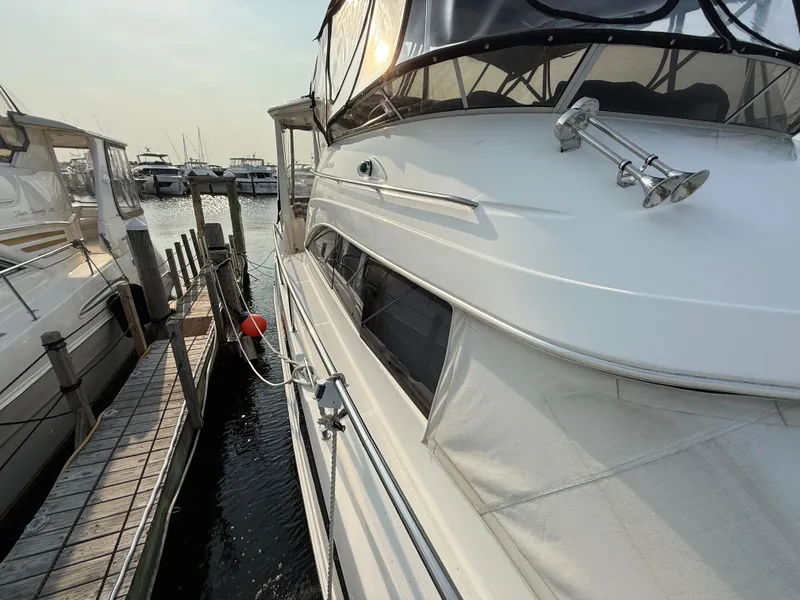Slide: The Image of 2005 Meridian 459 Motoryacht docked at marina, side view. - 6