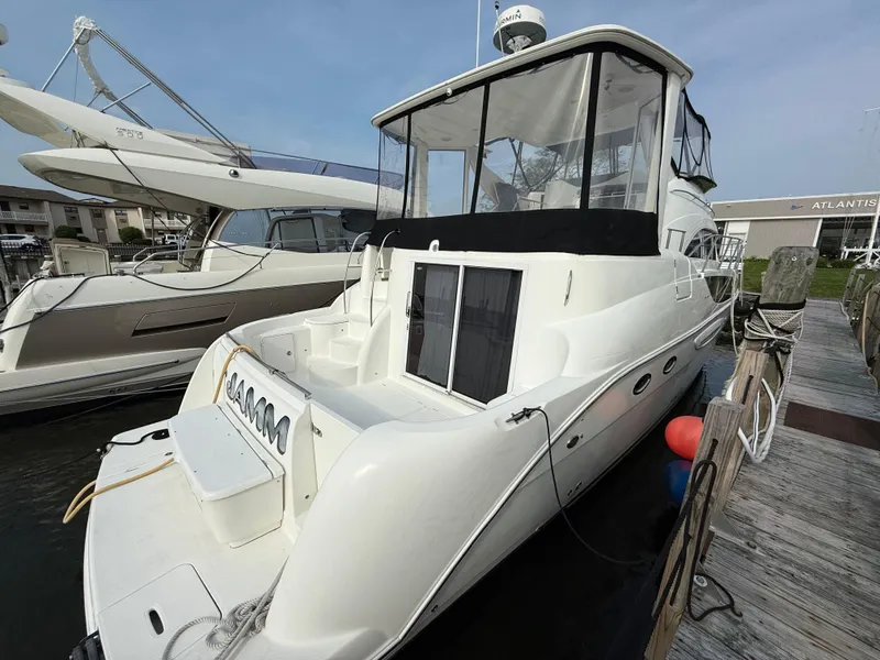 Slide: The Image of 2005 Meridian 459 Motoryacht docked at marina, rear view. - 8