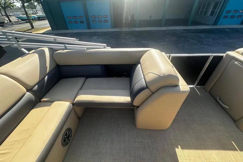 Slide: The Image of 2022 Harris Cruiser 230 boat interior with beige seating and modern design. - 7