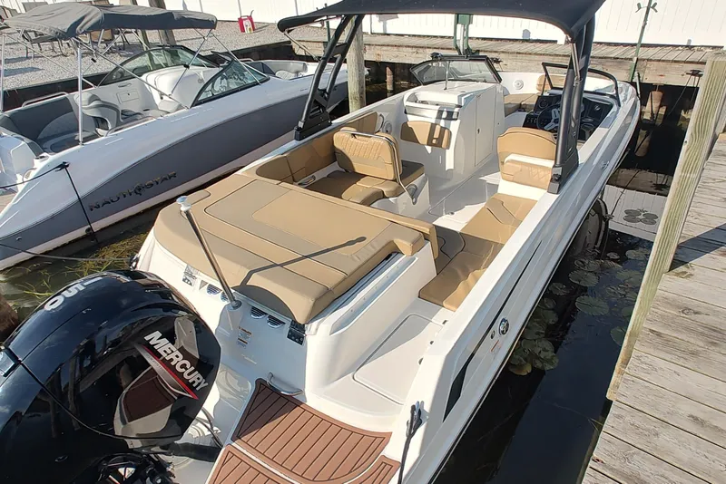 Slide: The Image of 2024 Bayliner VR6 Bowrider OB with Mercury outboard engine docked at marina. - 5