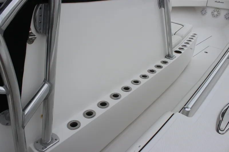 Slide: The Image of 2015 SeaHunter 45 Tournament boat interior with rod holders and stainless steel railings. - 26