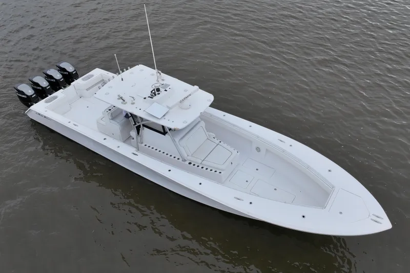 Slide: The Image of 2015 SeaHunter 45 Tournament boat with four outboard engines on calm water. - 6