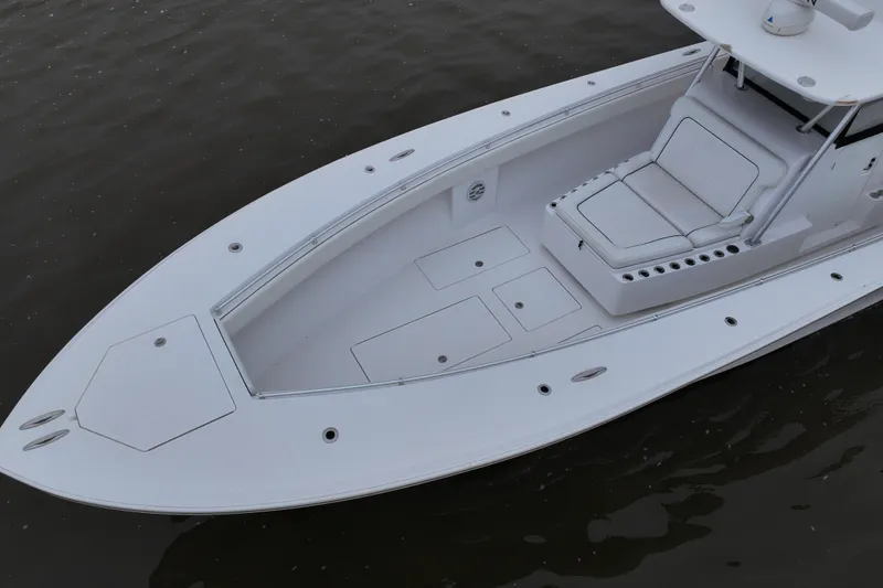 Slide: The Image of 2015 SeaHunter 45 Tournament boat, spacious deck, white seating, calm water background. - 7