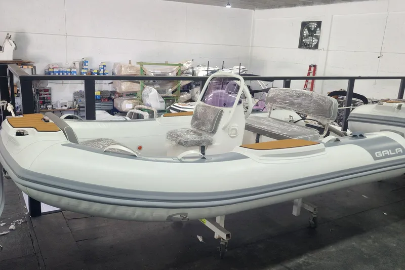 The Image of 2024 Gala A330L inflatable boat in a workshop, partially assembled and wrapped. - 0