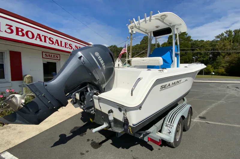 Slide: The Image of 2008 Sea Hunt Triton 220 boat with Yamaha engine on trailer at dealership. - 10