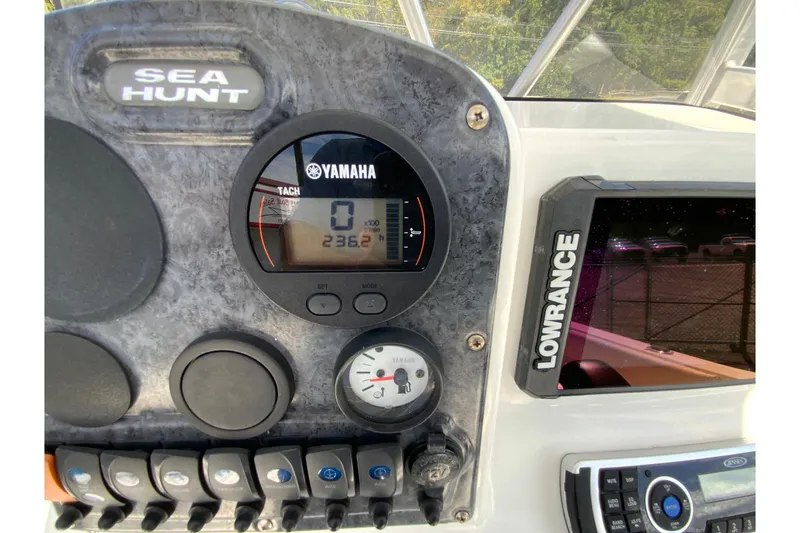 Slide: The Image of Dashboard of a 2008 Sea Hunt Triton 220 boat with Yamaha tachometer and Lowrance display. - 18