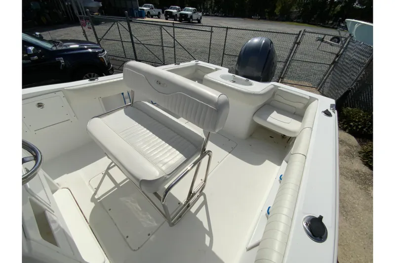 Slide: The Image of 2008 Sea Hunt Triton 220 boat interior with seating and console. - 19