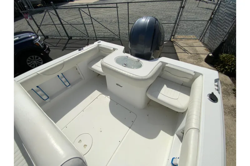 Slide: The Image of 2008 Sea Hunt Triton 220 boat interior with seating and engine view. - 20