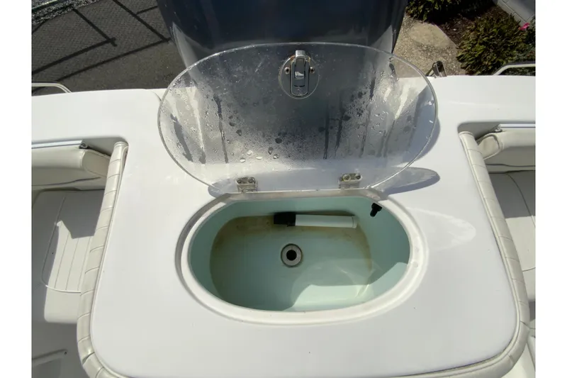 Slide: The Image of Livewell on a 2008 Sea Hunt Triton 220 boat, open lid, white interior. - 21