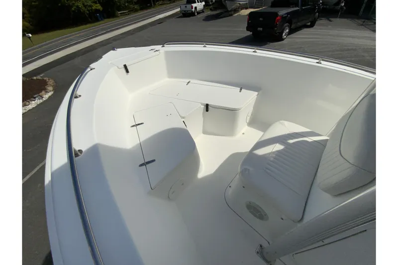 Slide: The Image of 2008 Sea Hunt Triton 220 boat interior with seating and storage compartments. - 25