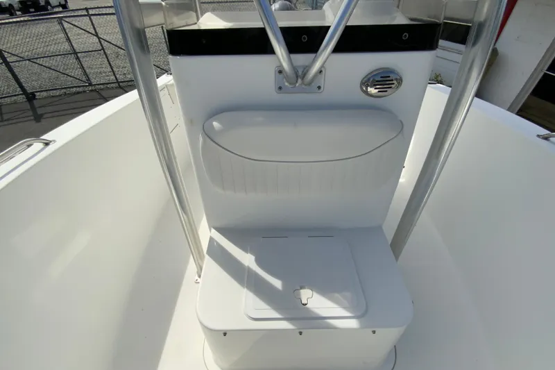 Slide: The Image of 2008 Sea Hunt Triton 220 boat interior with seating and storage compartment. - 32